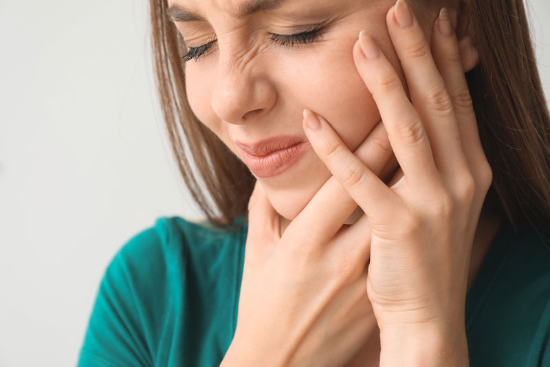 An image of a dental patient suffering from failed dental implants.